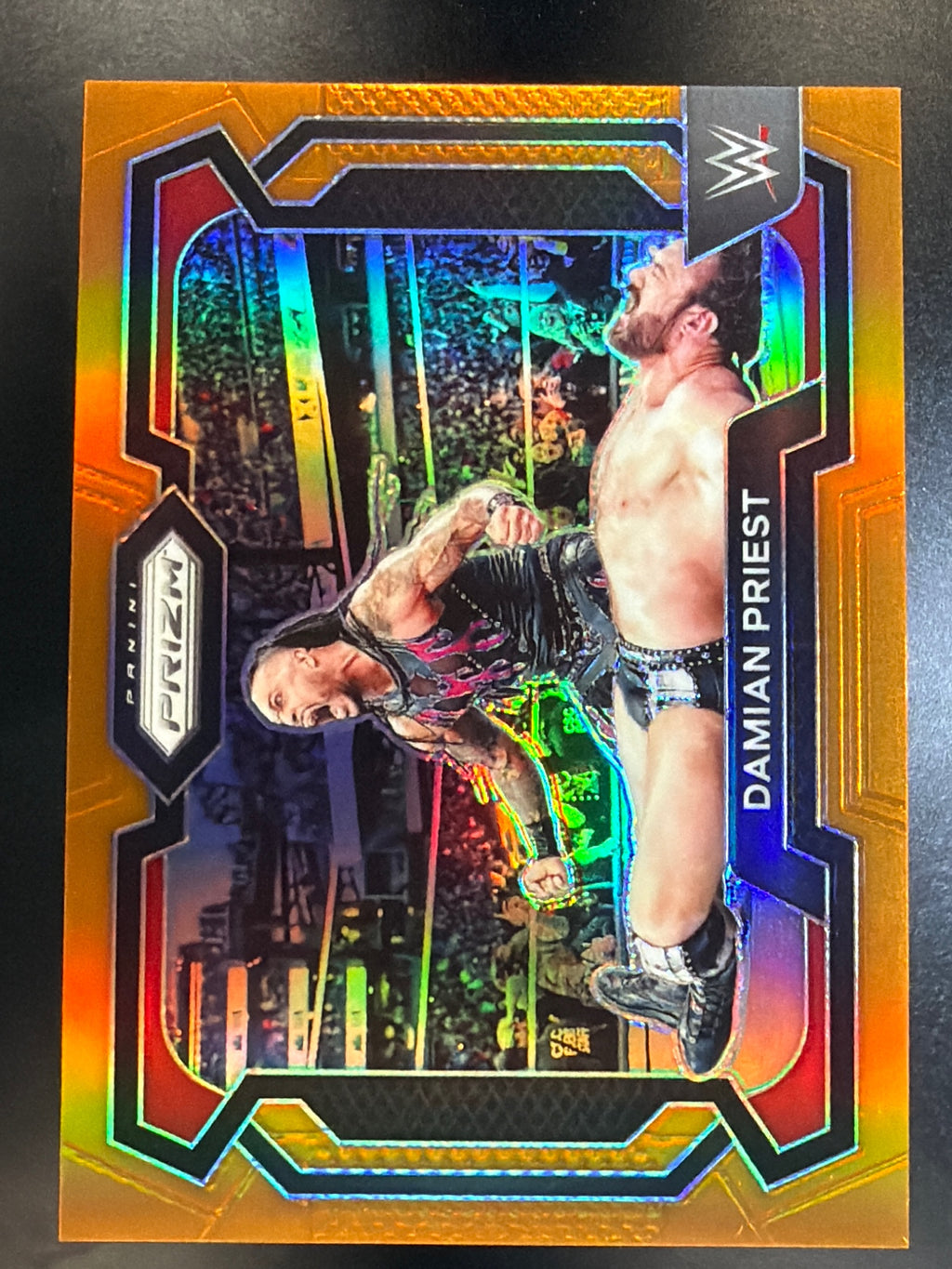 2024 Panini Prizm WWE #58 Damian Priest Orange Prizms #/99