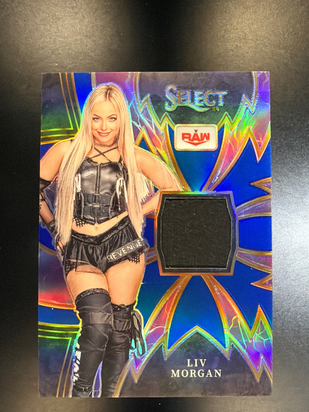 2024 Panini Select WWE #SP-LVM Liv Morgan Sparks Memorabilia Blue Prizms #/49