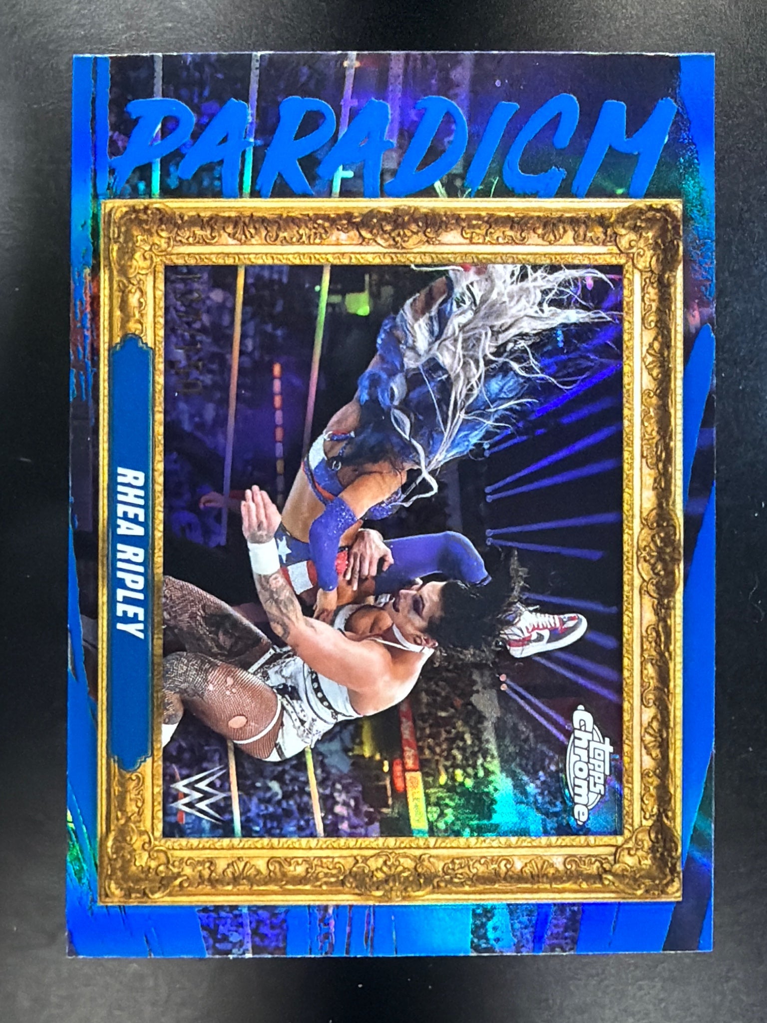2025 Topps Chrome WWE #PAR-RRY Rhea Ripley Paradigm Blue Refractor #/150